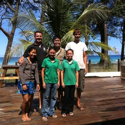 Group on deck with ocean behind