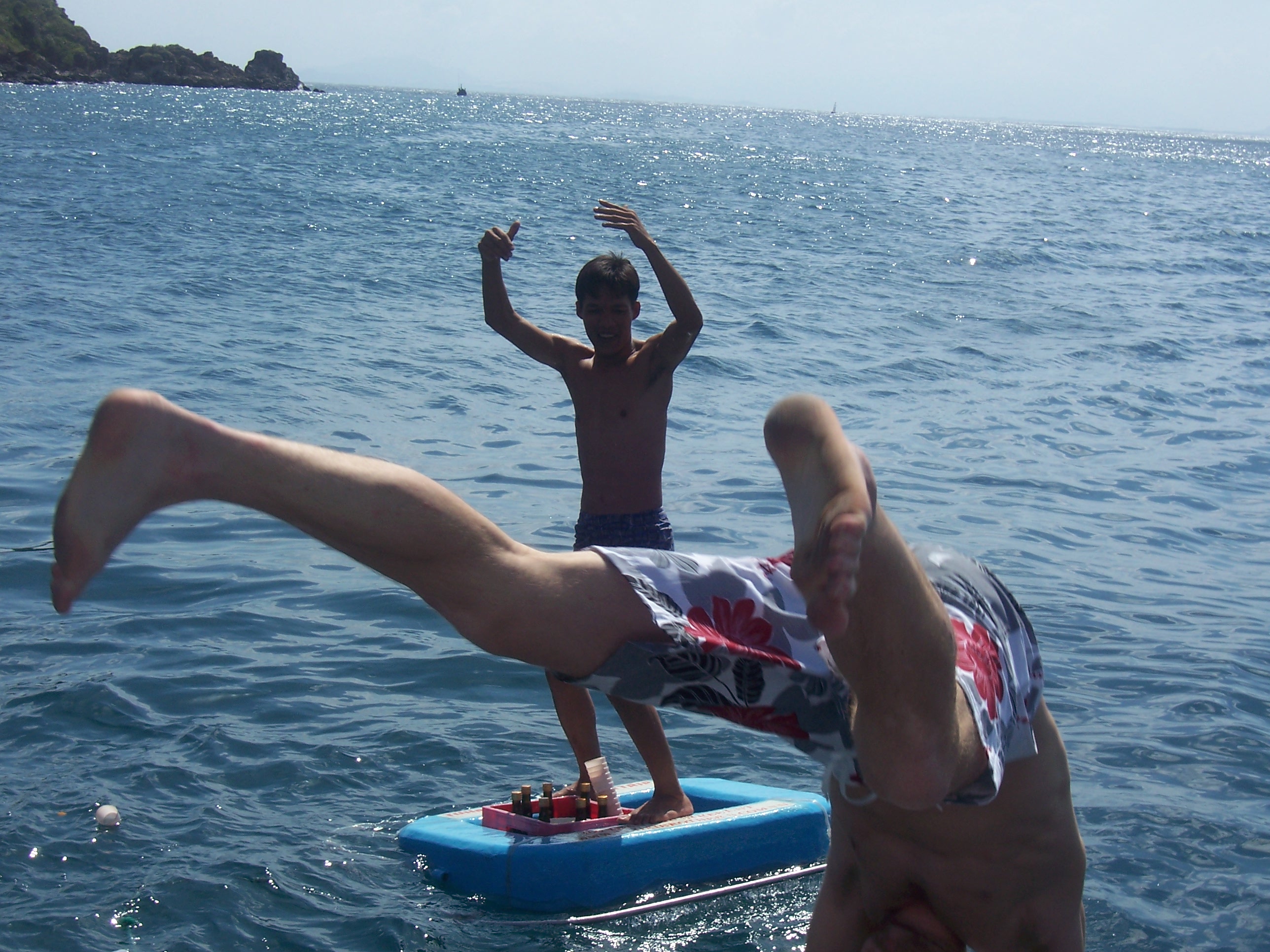 Backflip near a floating tray of drinks