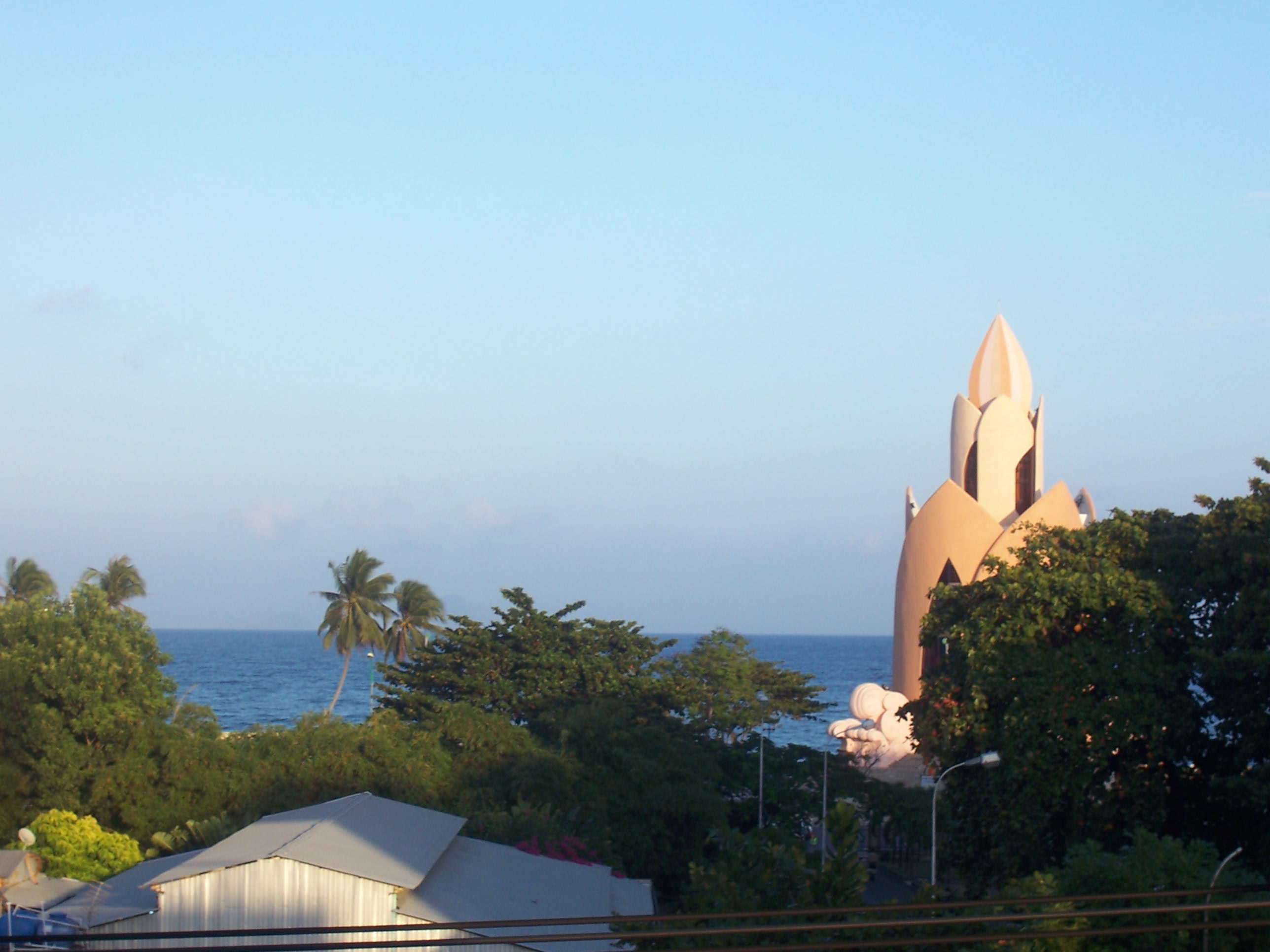 Lotus tower by the sea at dusk