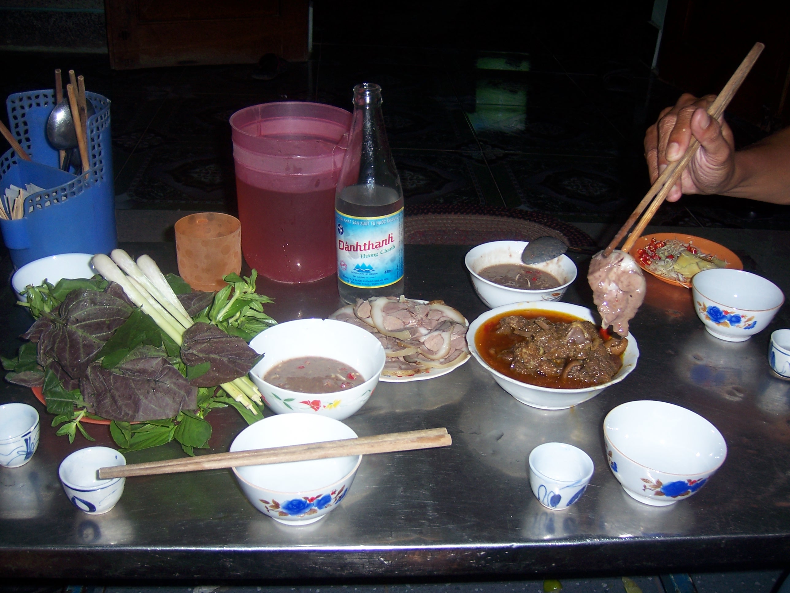 Low table with herbs, lemongrass and rice whisky
