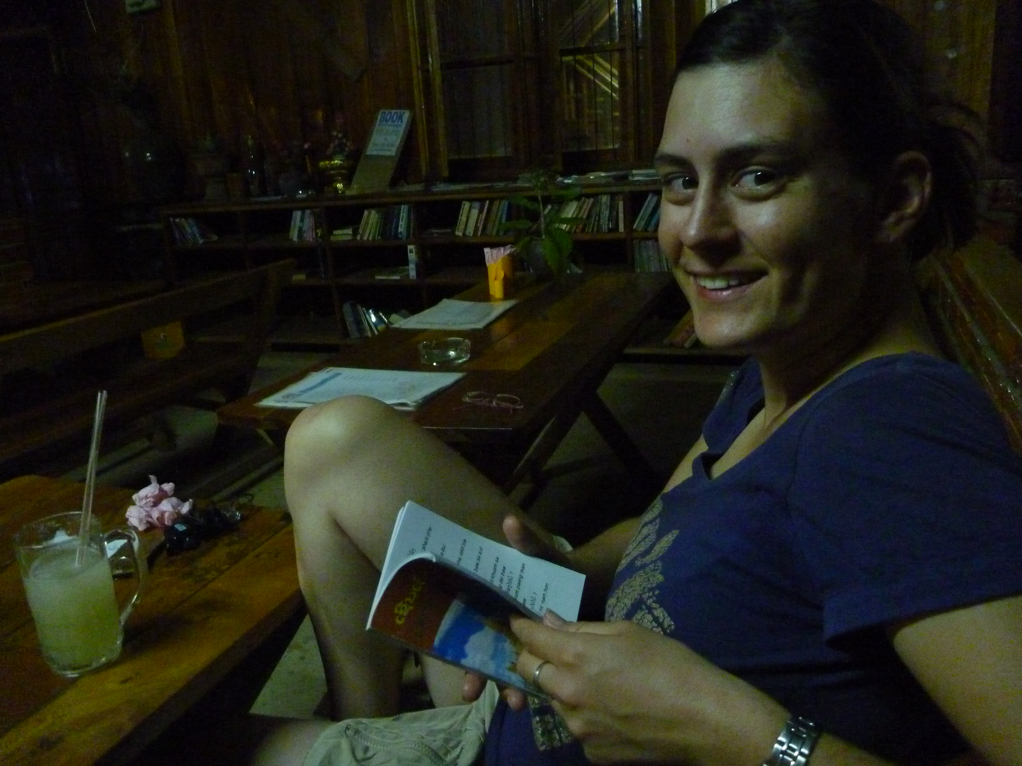 Lea with her drink and a book