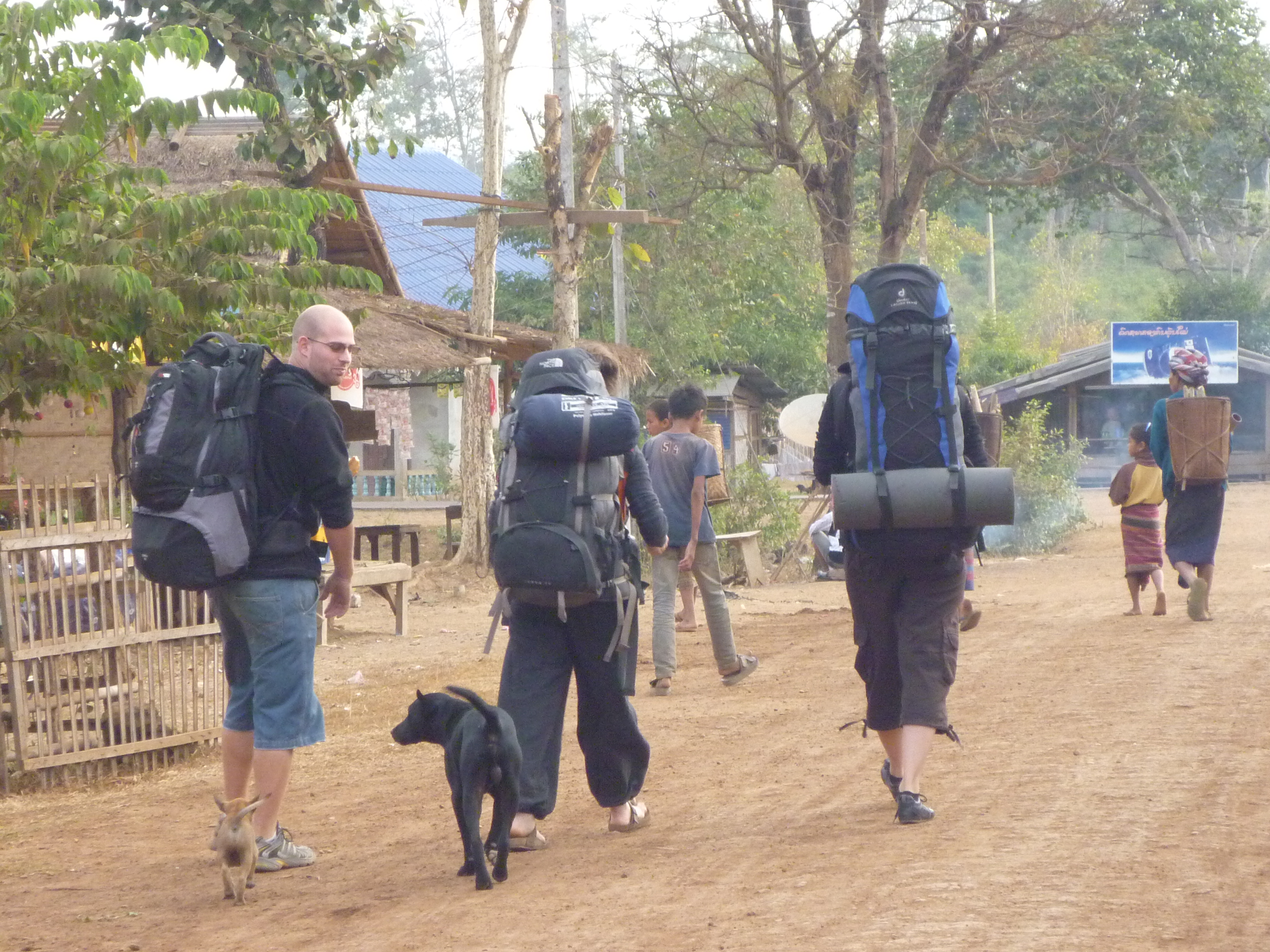 Me, the crew, and Lipstick walking through the village with backpacks